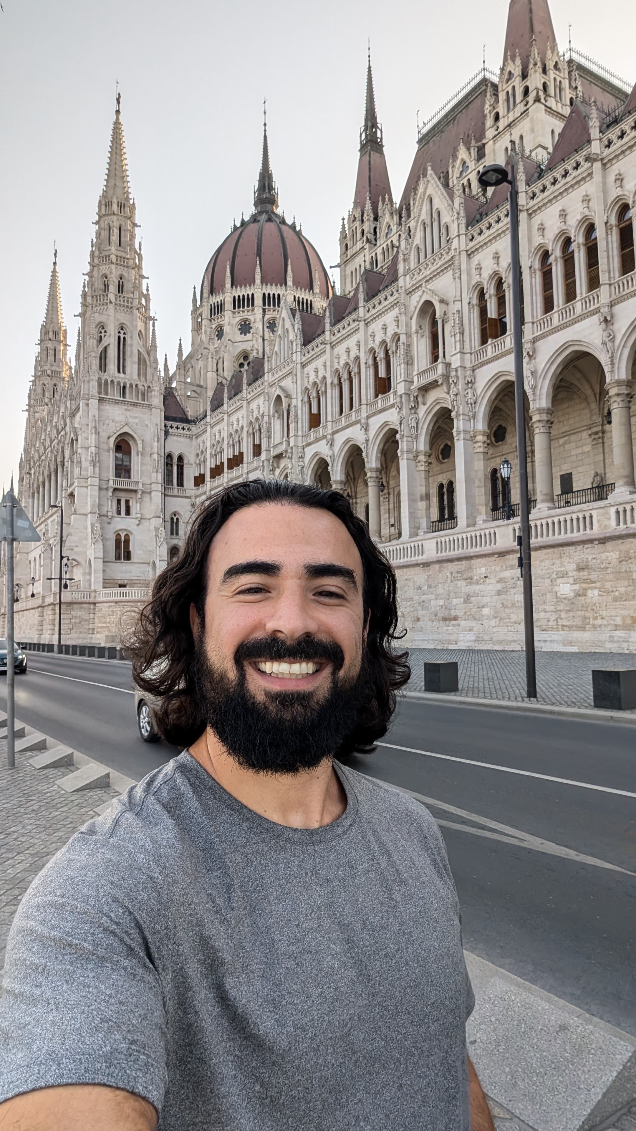 Széchenyi Baths outdoor pool in winter steam. Old men playing chess on floating boards.
