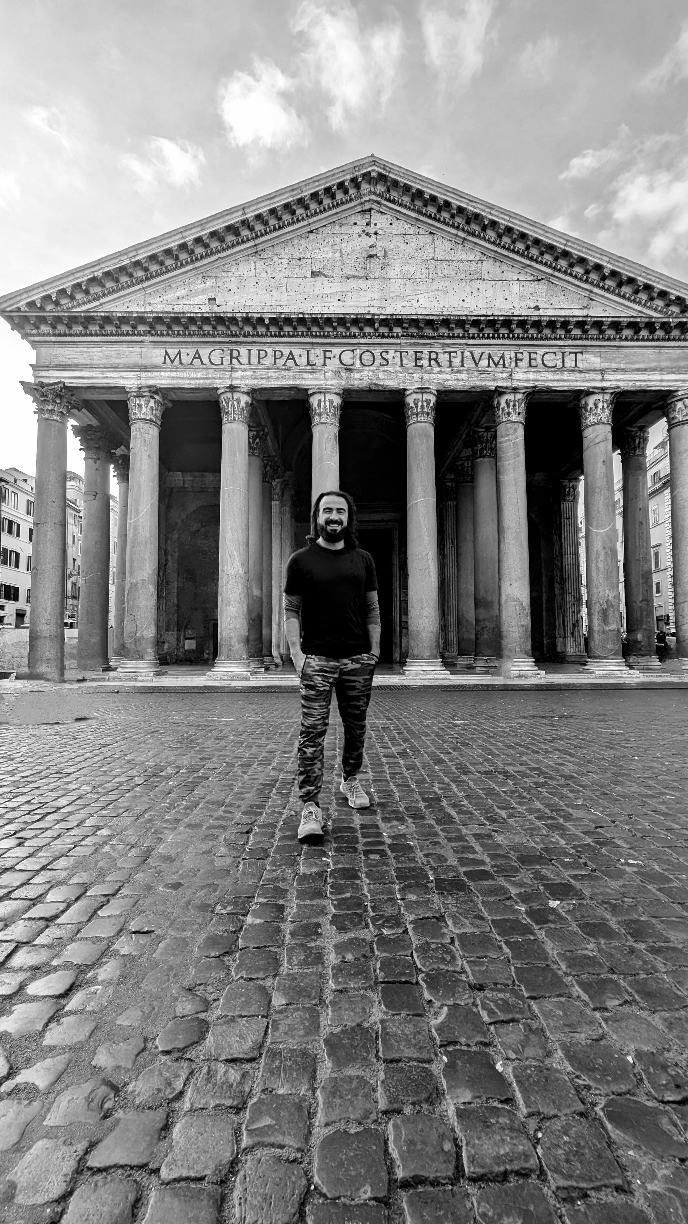 The Colosseum at golden hour. Seventy thousand seats, once. Now tourists and pigeons.