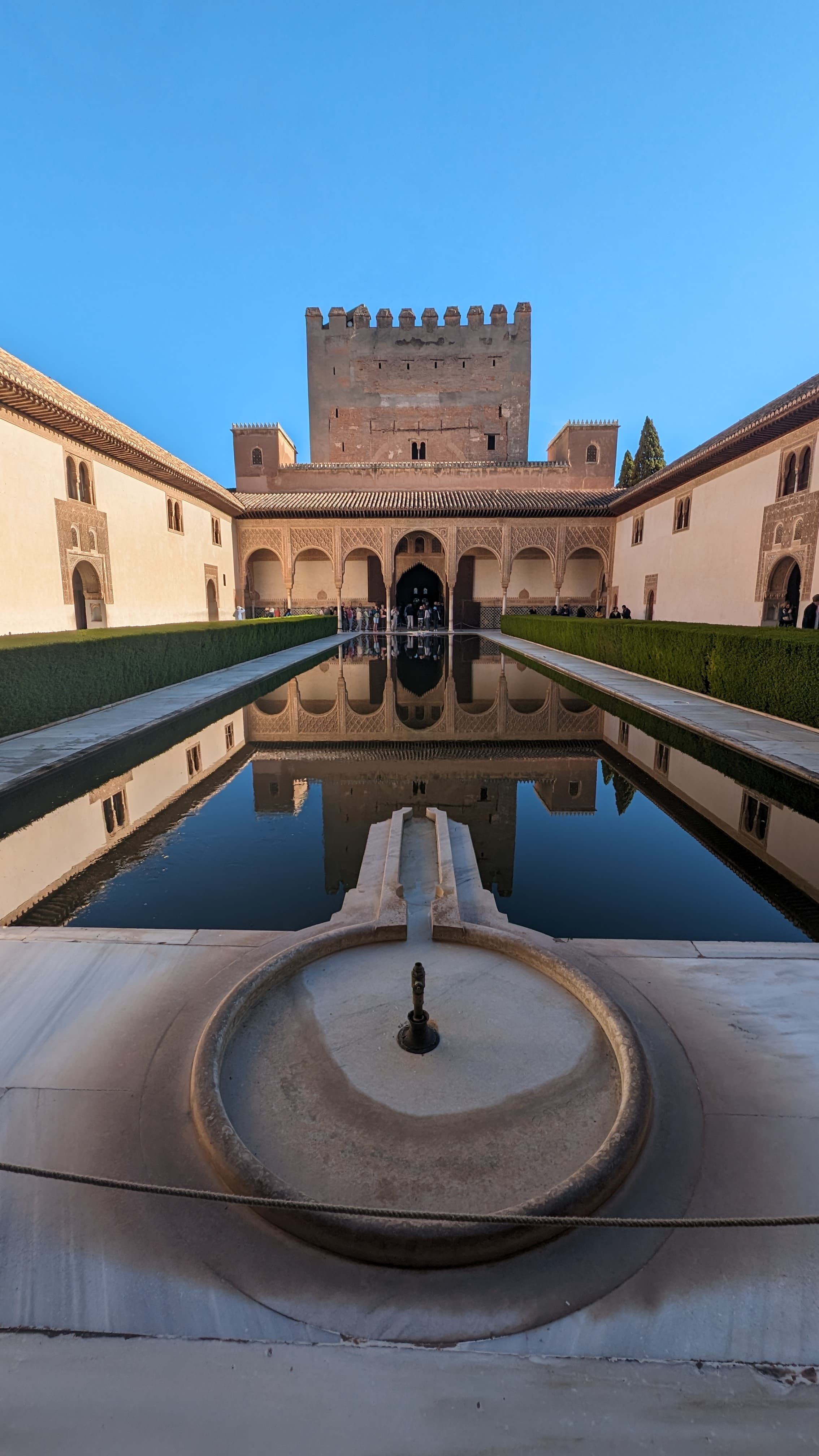 The Mirador de San Nicolás at sunset. The Alhambra against the Sierra Nevada.