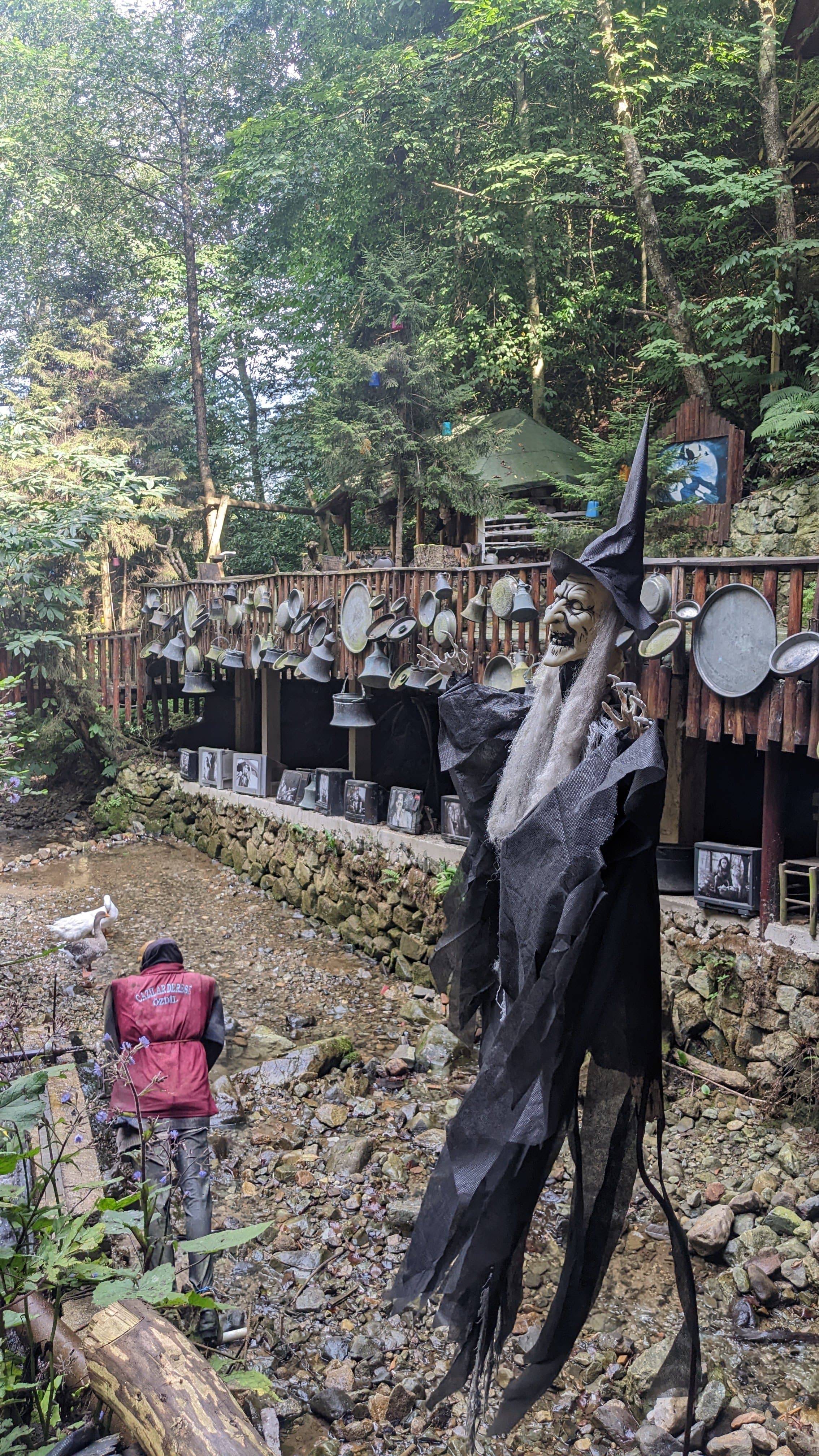 Uzungöl at first light. Mist on the water, the minaret just visible, the hills going dark green above.