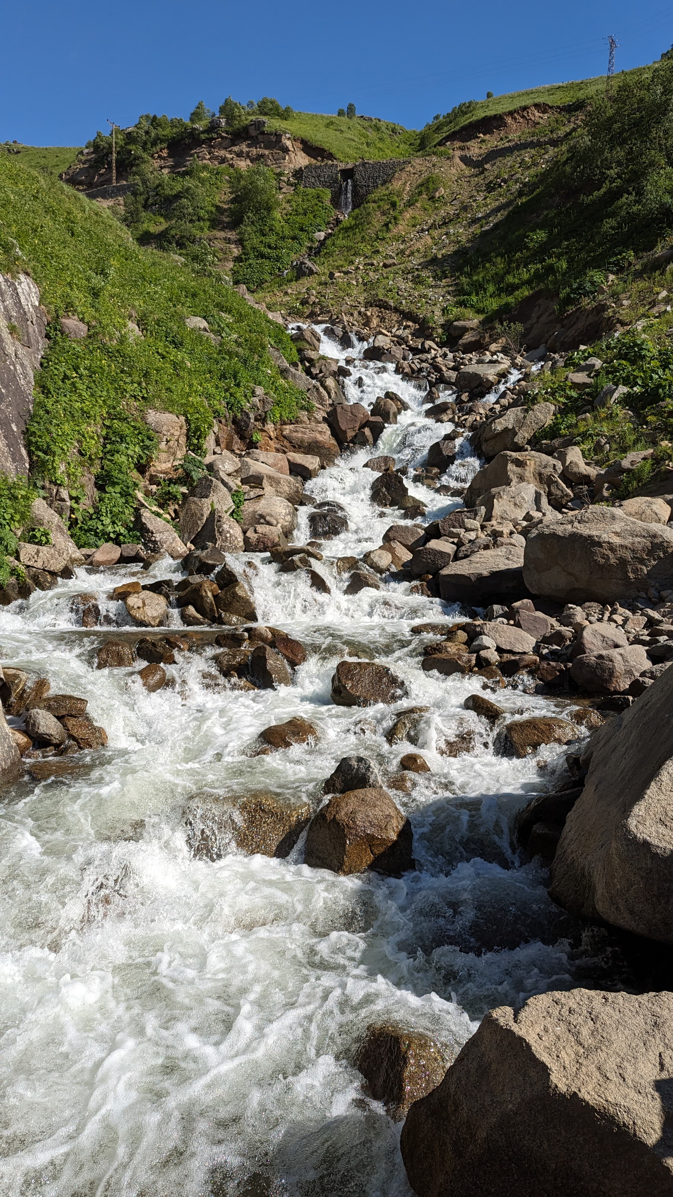 Kuymak arriving at the table. Cornmeal, local cheese, butter. Not for the faint-hearted.
