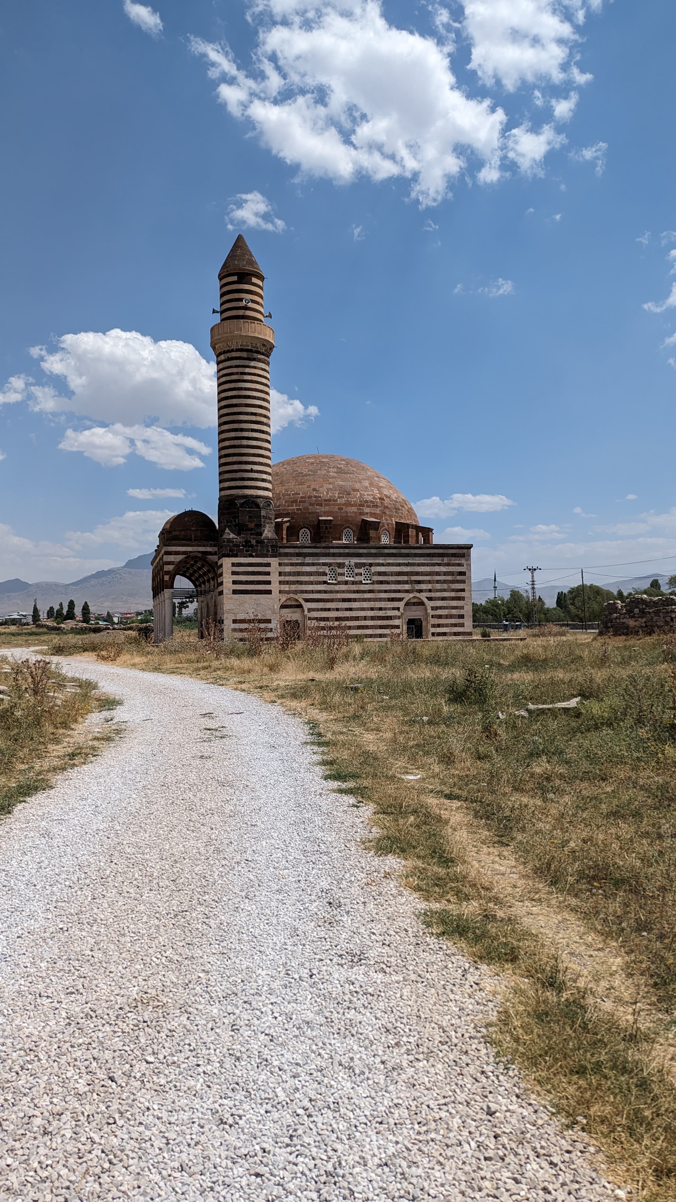 Lake Van from the shore. 3,755 square kilometres of alkaline water, mineral blue at noon.