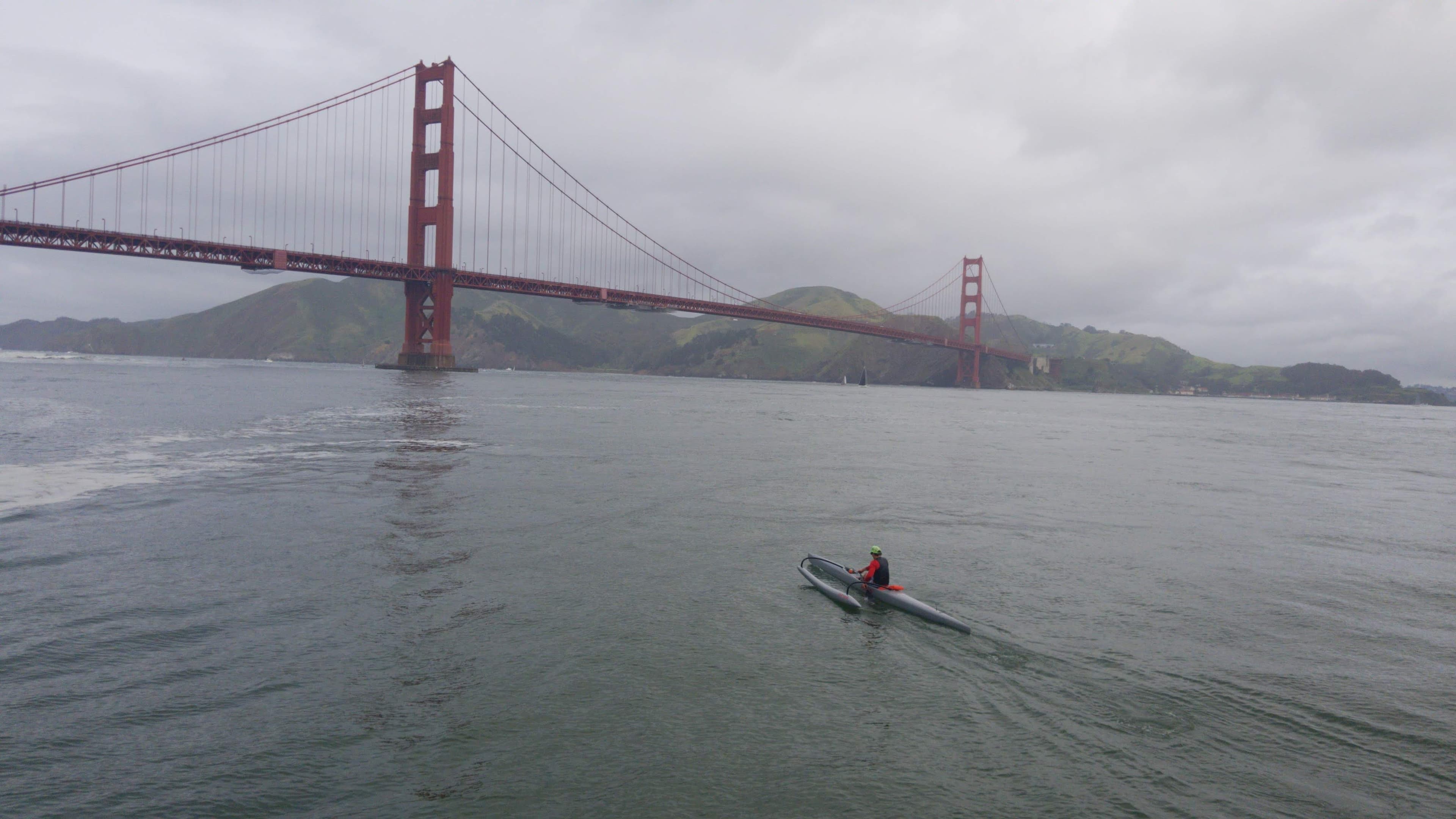 San Francisco city skyline with the Bay Bridge and waterfront at dusk with Coit Tower visible