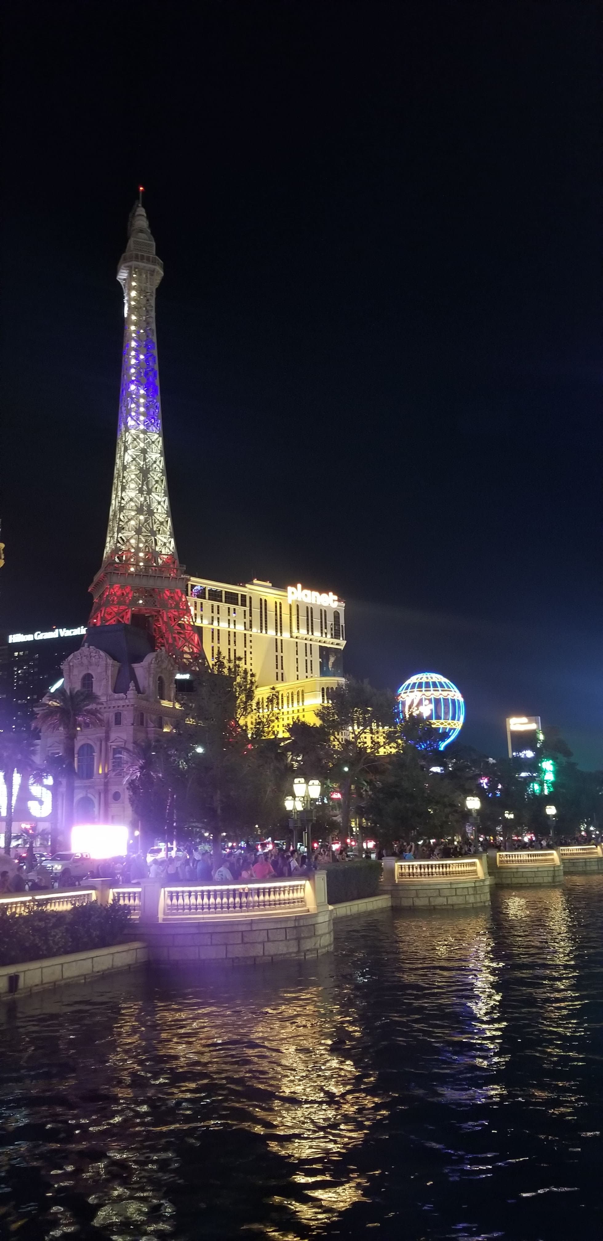 The Strip at night. The scale of the illumination is industrial; the effect is genuinely disorienting.