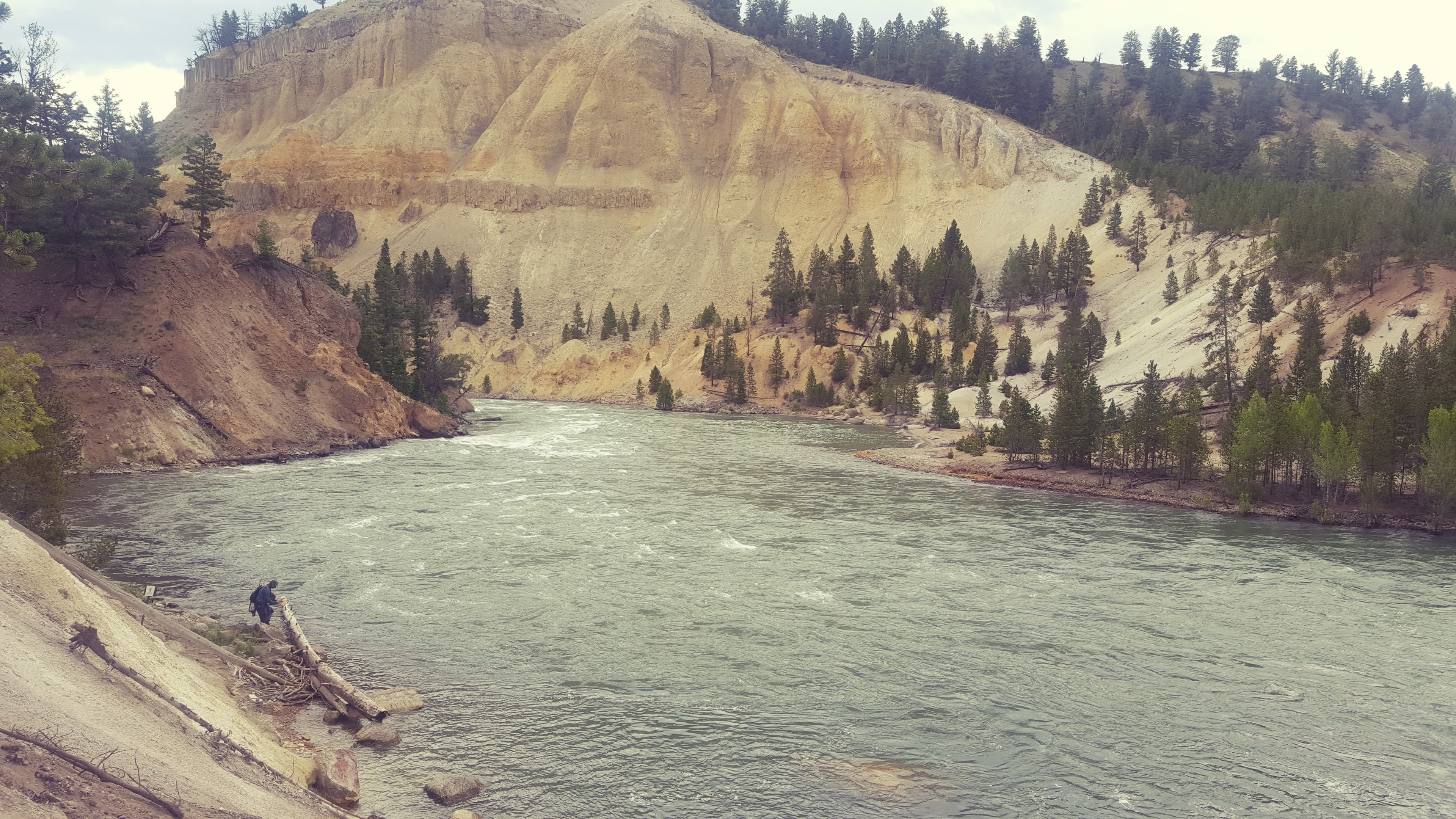 Yellowstone hot spring boardwalk. The water is 200°F; the colour changes with depth and bacterial life.