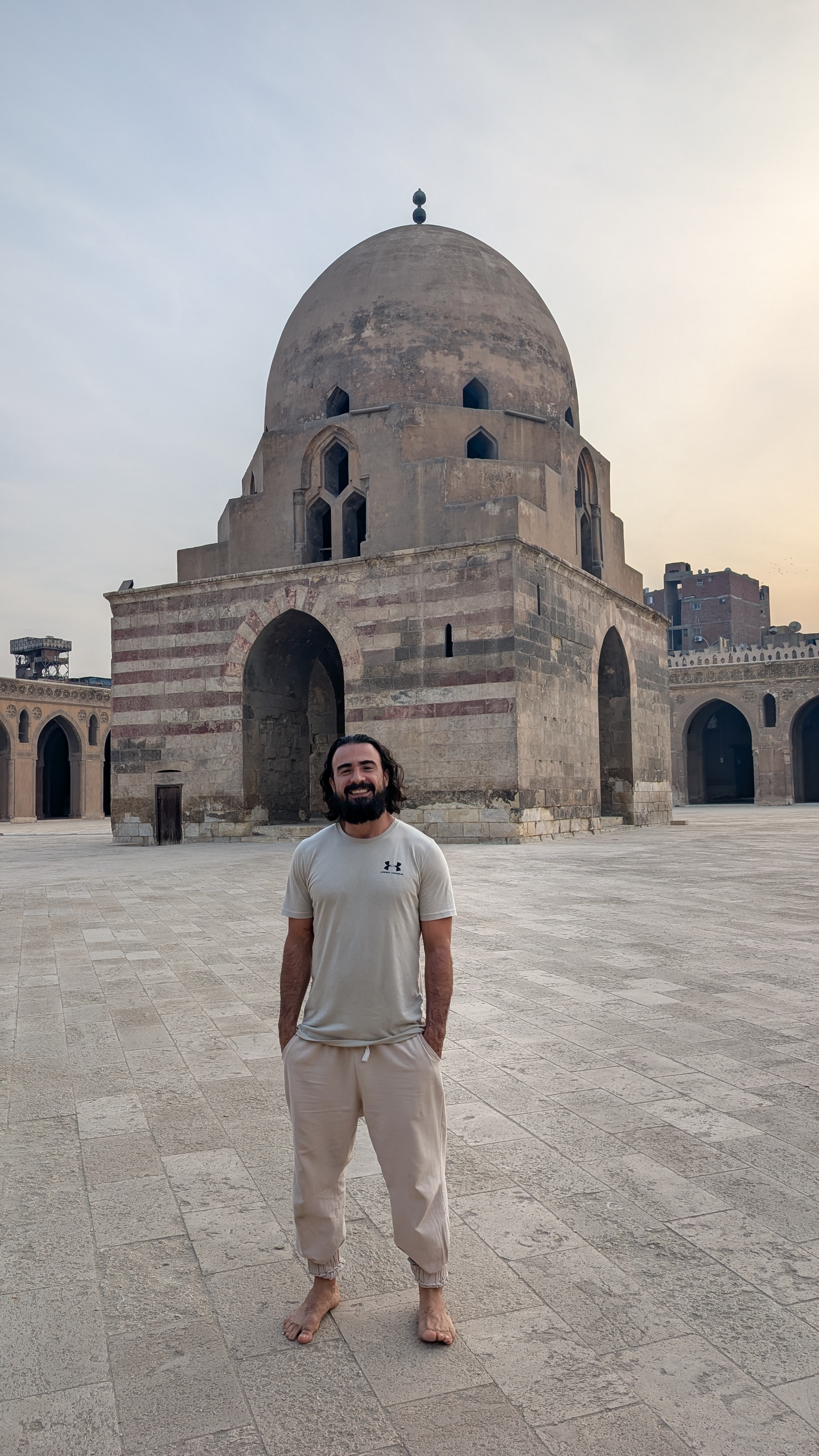 Standing in the Ibn Tulun Mosque courtyard at golden hour