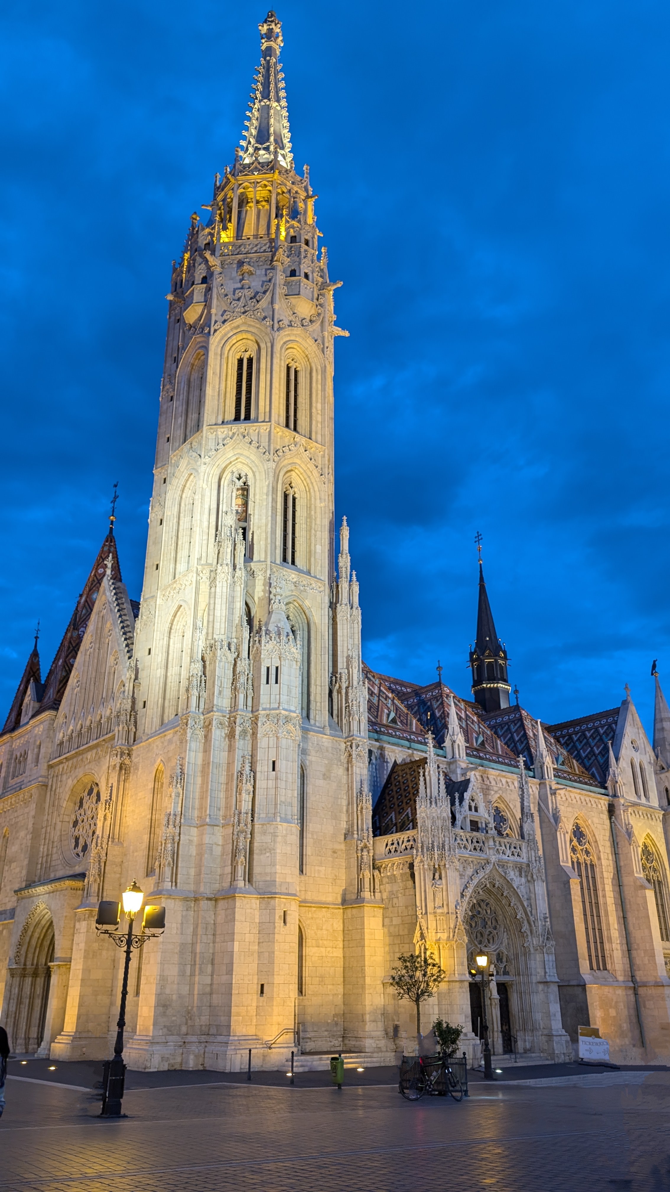 Budapest Parliament building illuminated at night reflected in the Danube