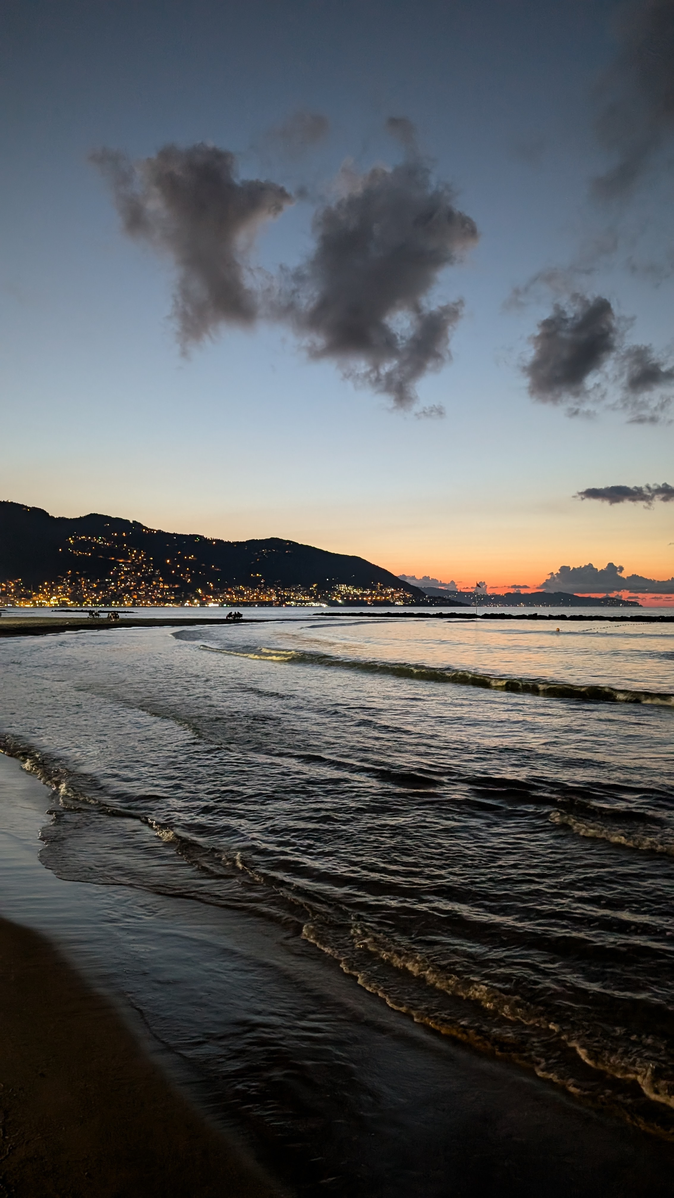Sunset seascape, rocky Black Sea coast with silhouetted mountains
