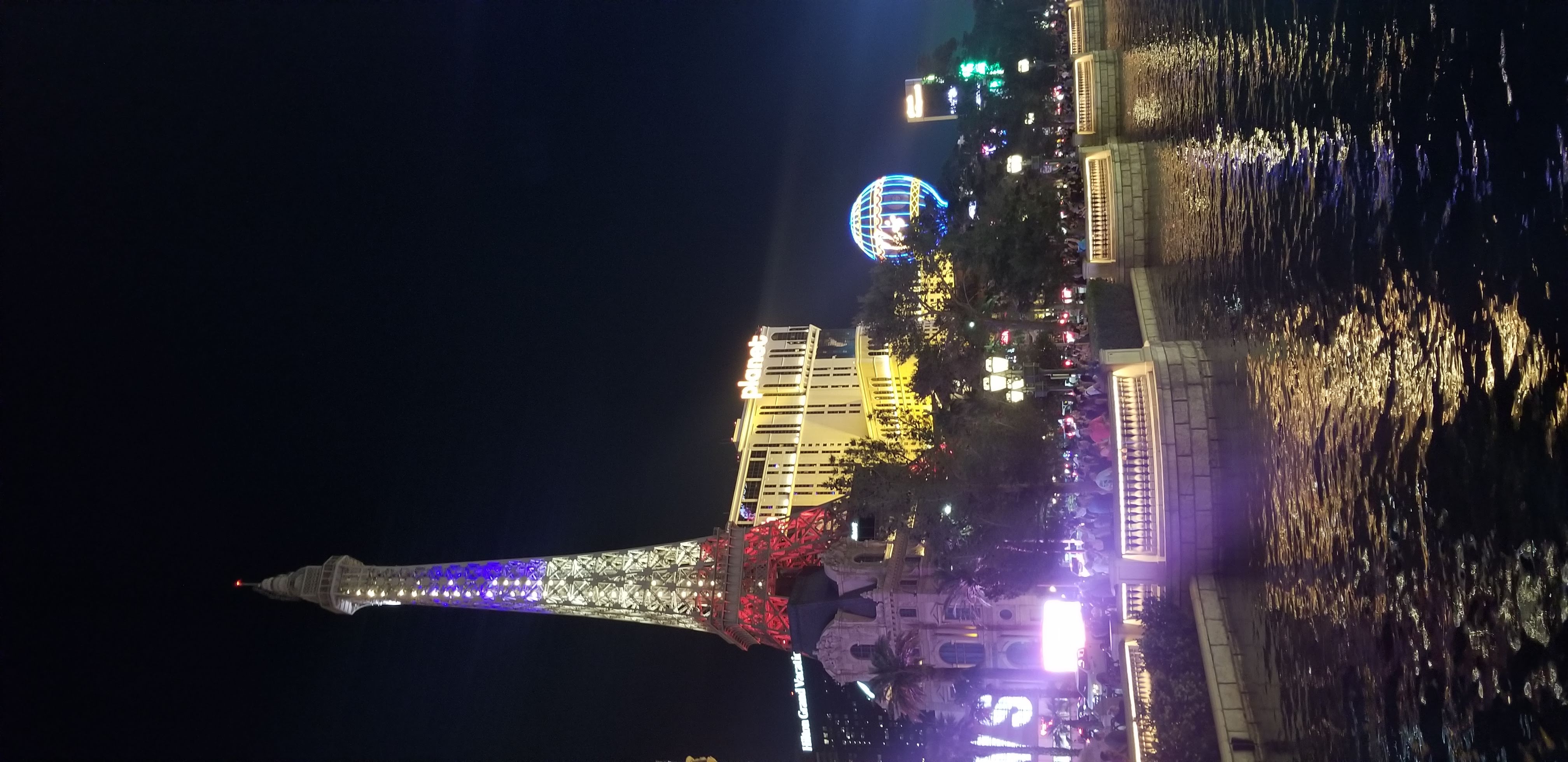 Las Vegas Strip at night with the neon signs and resort hotels illuminating the desert sky